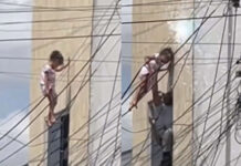 Policial arrisca a própria vida para salvar menina pendurada em fios elétricos